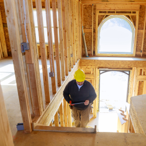 Image of General Contractor Inside a Framed Custom Home under Construction